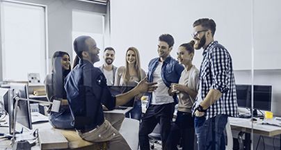 Group of diverse professionals having a discussion in a modern office setting.