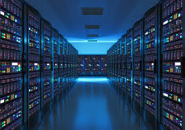 Modern data center with rows of illuminated server racks.